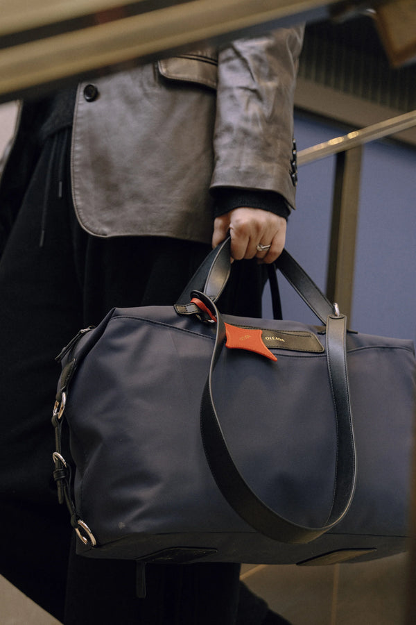 Anywear Duffle: Recycled Leather & Waterproof High-density Technical Fabric