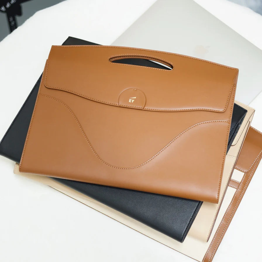 Custom Laptop Sleeve Program: Made With Recycled Leather. 50 Piece Minimum Order.
